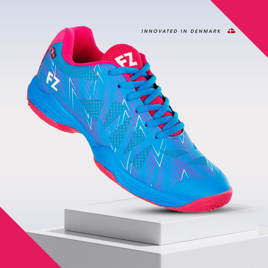 FZ Forza Taila shoes, blue badminton shoes, Drylex badminton footwear, F-Zone grip shoes, ASE support shoes, lace-up court shoes, breathable badminton footwear, lightweight sports shoes, Dura Coat badminton shoes, performance athletic shoes